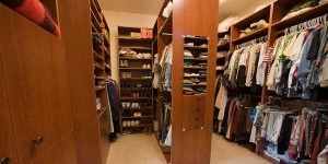 There are closets and there are closets! This custom designed and built walk-in master closet allows for total organization and maximum storage.