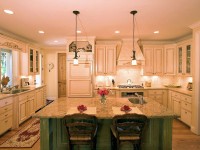 This kitchen has an antique glazing on the main cabinets and scratch-through finish on the island.