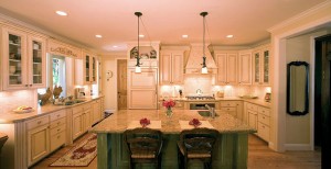 This kitchen has an antique glazing on the main cabinets and scratch-through finish on the island.